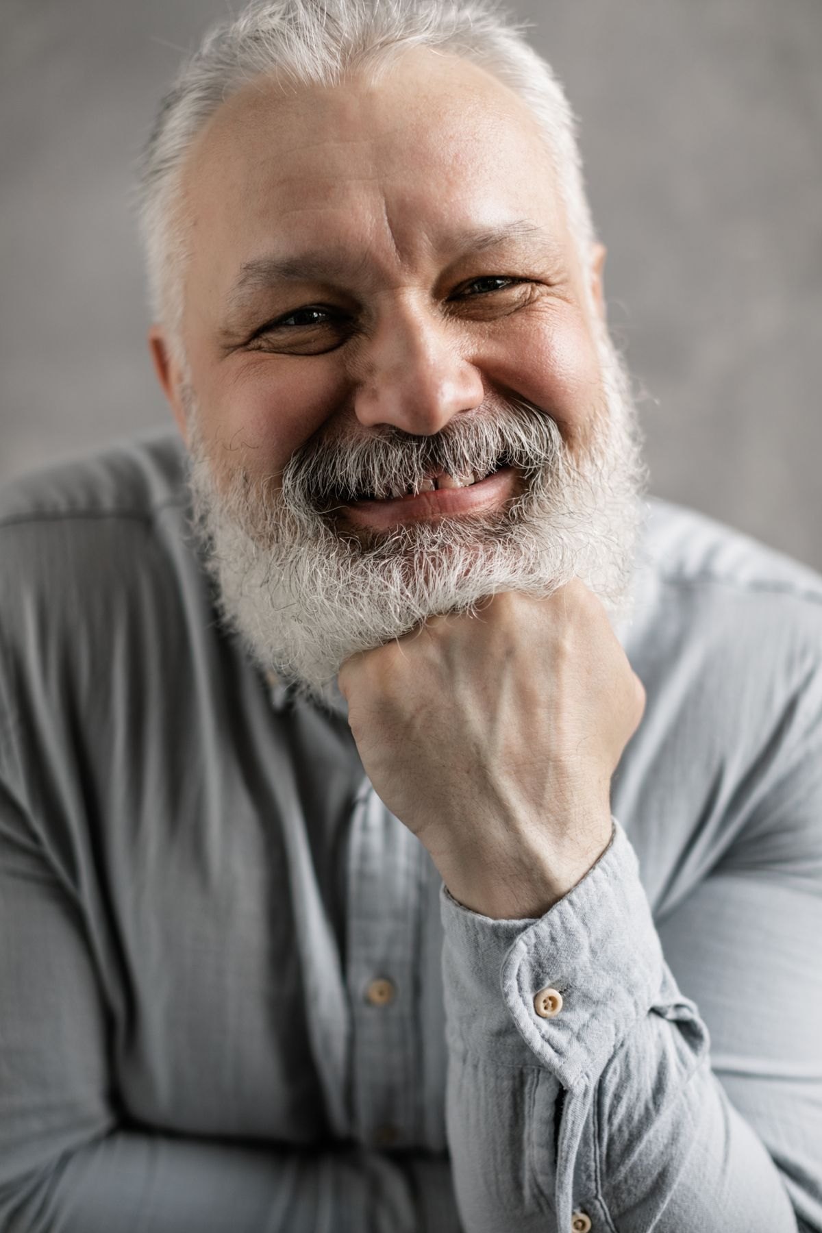 An older adult with a calm smile