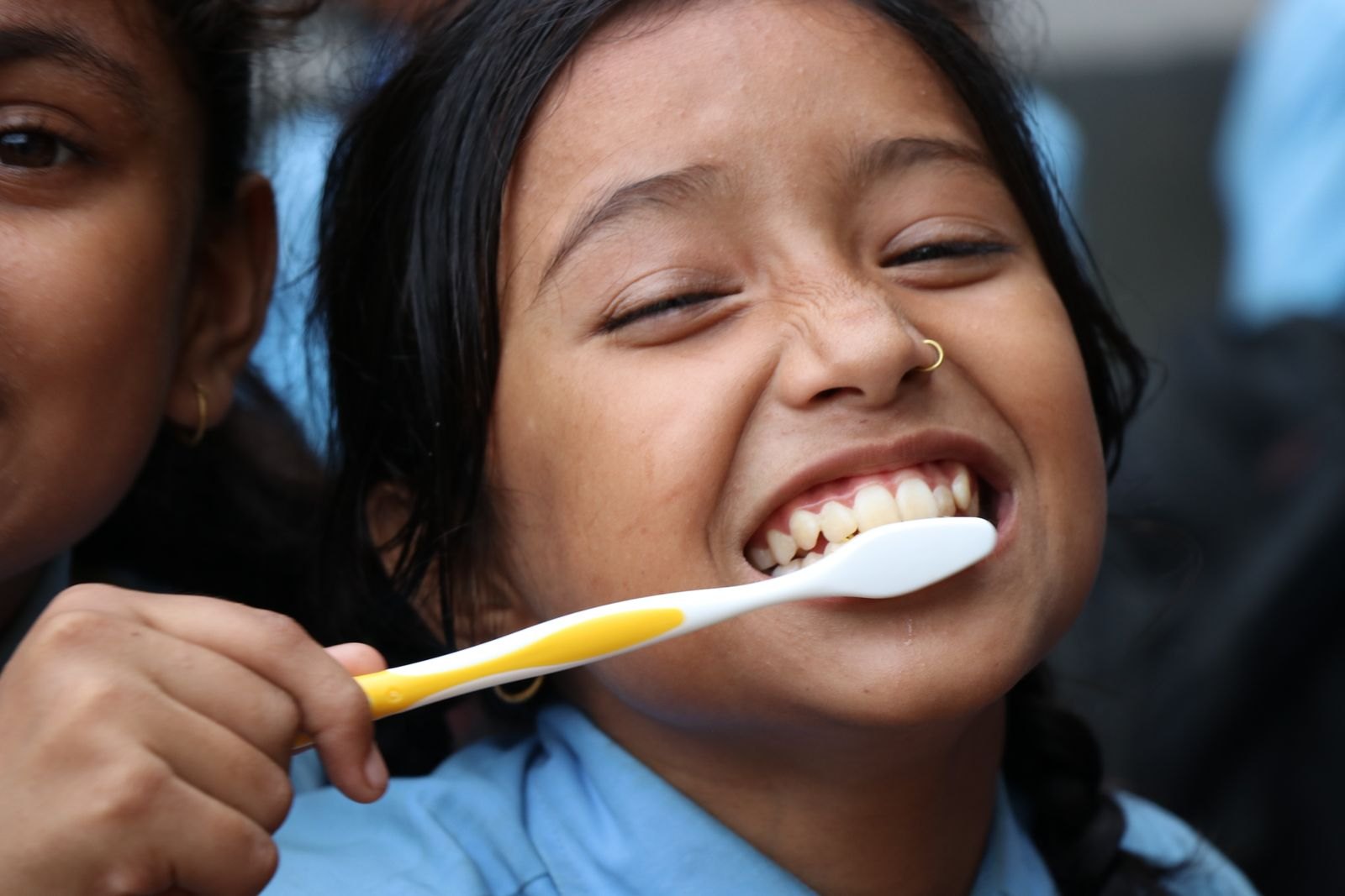 A child brushing teeth at home
